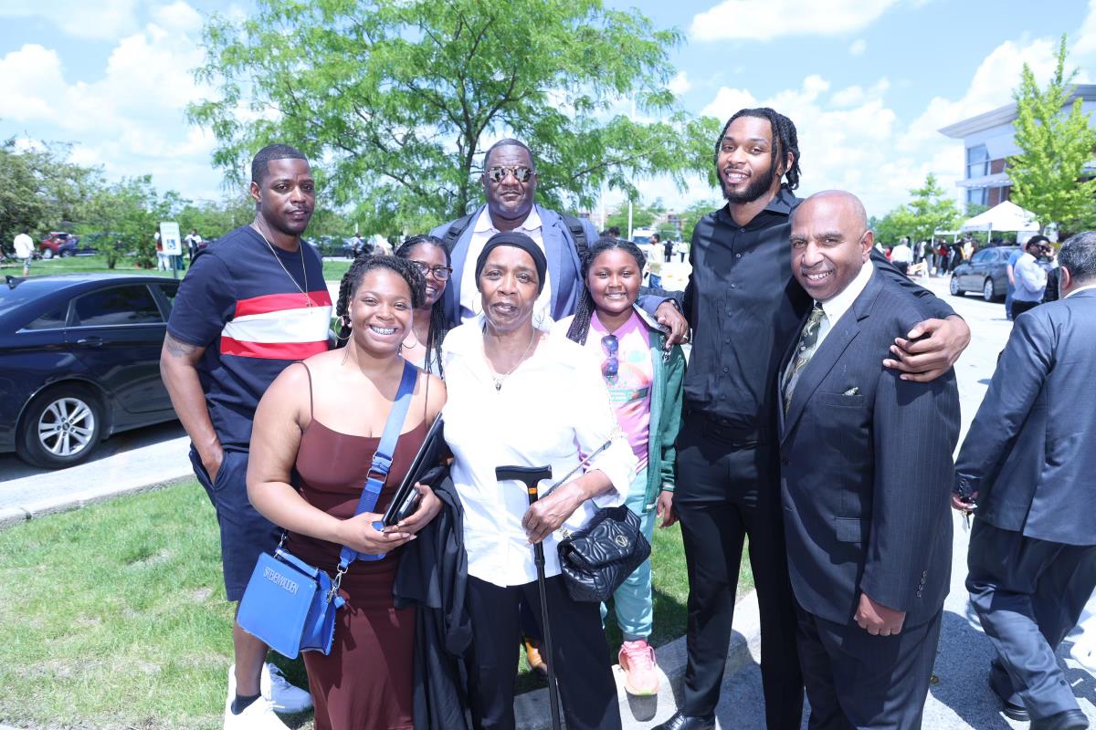 GSU Men's Basketball student-athlete, 2024 Graduate Tyler Clarke family with GSU Athletic Director and Men's Basketball Coach Tony Bates (far right) at May 18 Commencement ceremonies at Tinley Park Convention Center.